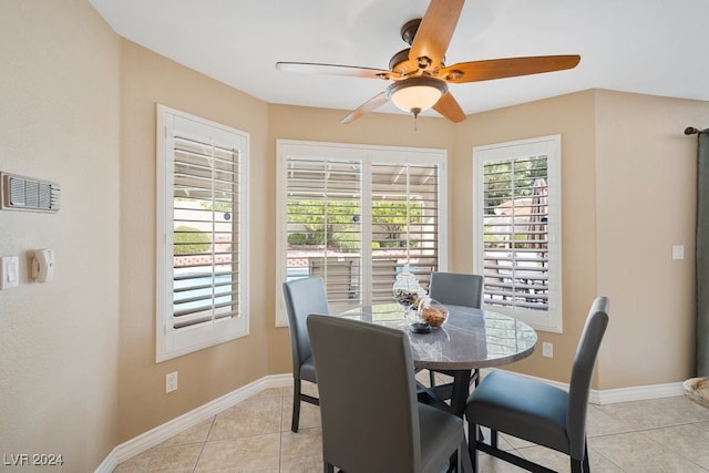 tiled dining room with ceiling fan