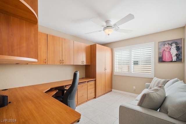 tiled office featuring ceiling fan