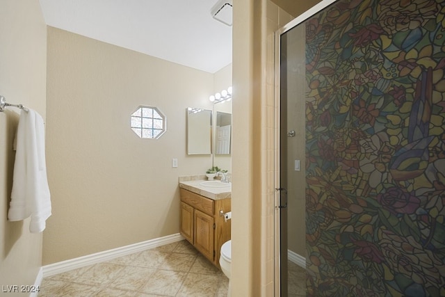 bathroom with tile patterned flooring, vanity, toilet, and a shower with door