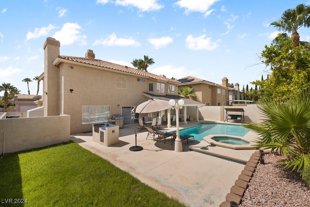 view of swimming pool with a patio area and an in ground hot tub