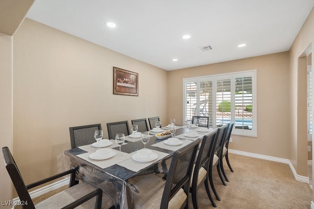 view of carpeted dining area