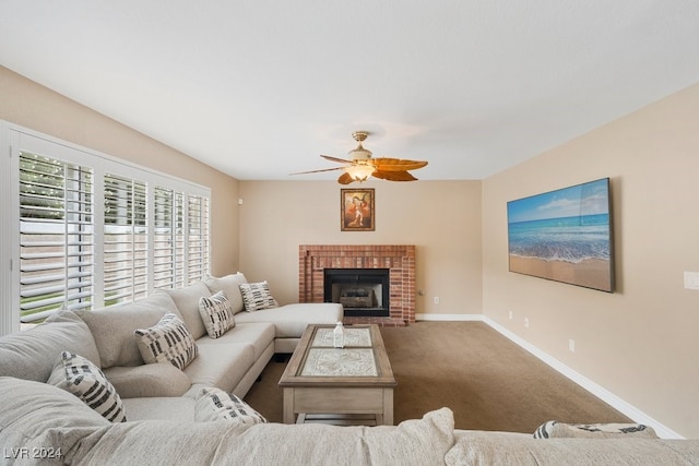 living room featuring ceiling fan, carpet, and a brick fireplace