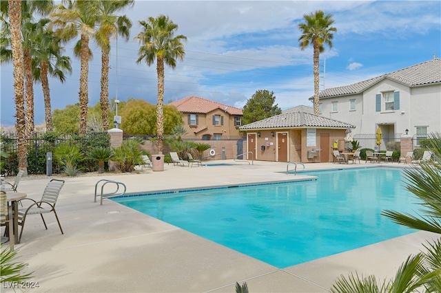 view of swimming pool with a patio