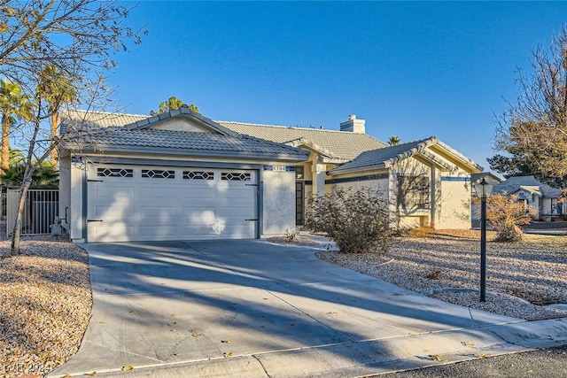 single story home with a garage