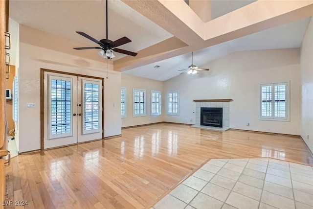 unfurnished living room with french doors, light hardwood / wood-style flooring, and ceiling fan