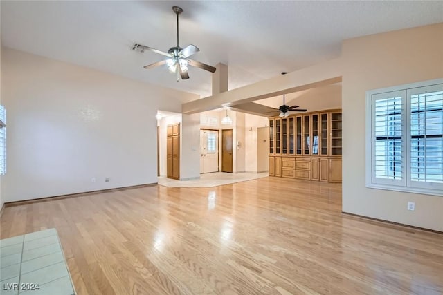 unfurnished living room with ceiling fan and light hardwood / wood-style floors