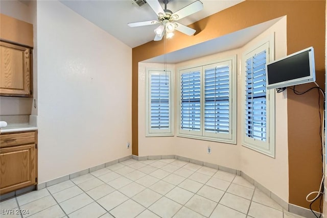 kitchen with ceiling fan and light tile patterned floors