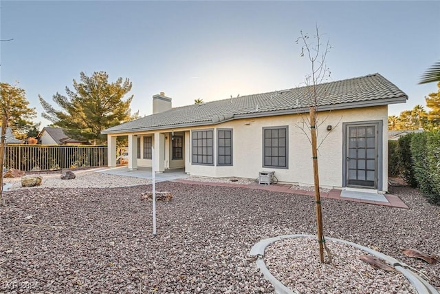 back of property featuring a patio