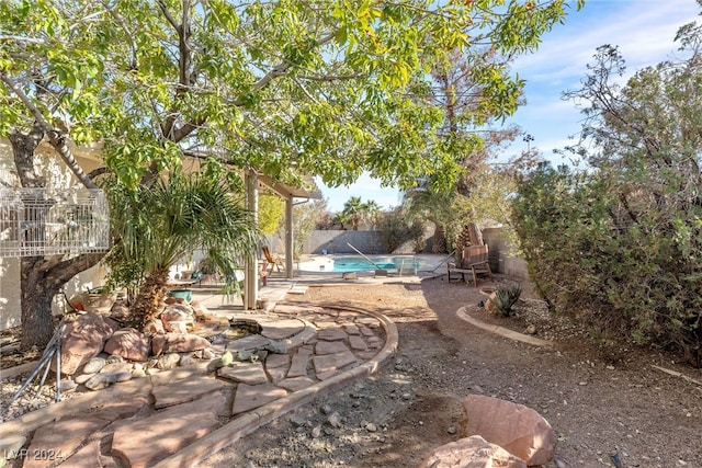 view of yard featuring a fenced in pool