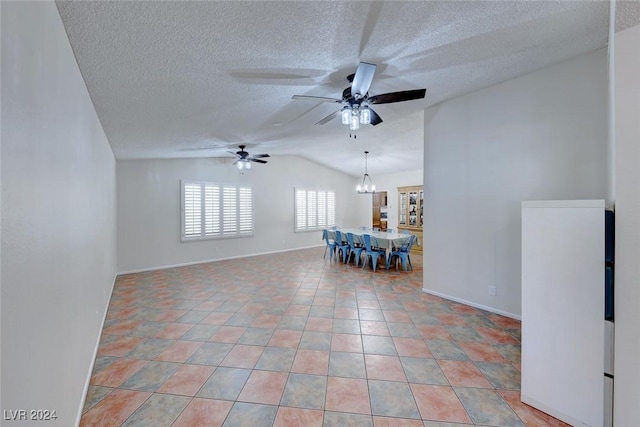 unfurnished room with a textured ceiling, ceiling fan with notable chandelier, and vaulted ceiling