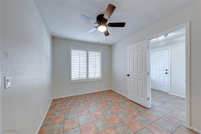 spare room with ceiling fan