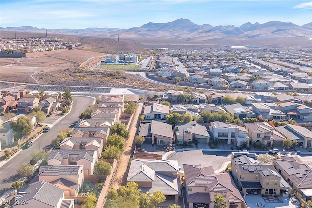 birds eye view of property with a mountain view