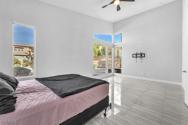 bedroom with ceiling fan and access to outside