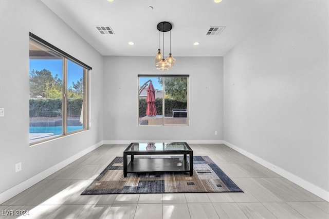 unfurnished dining area with tile patterned flooring