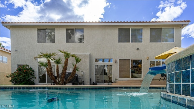 back of house with pool water feature