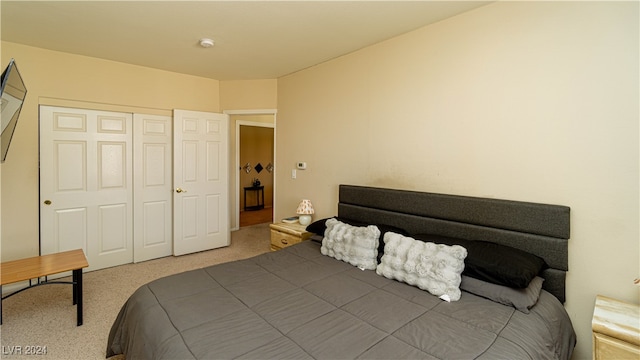 carpeted bedroom featuring a closet