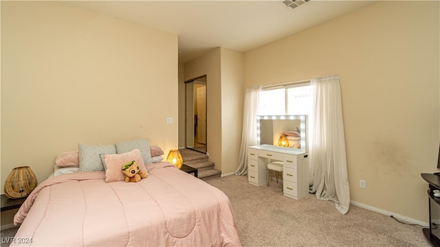 bedroom with light colored carpet