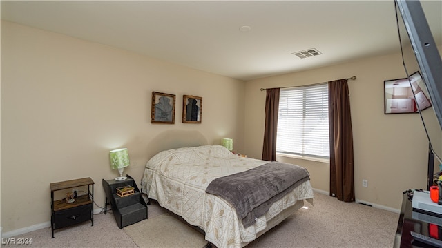 bedroom with light carpet