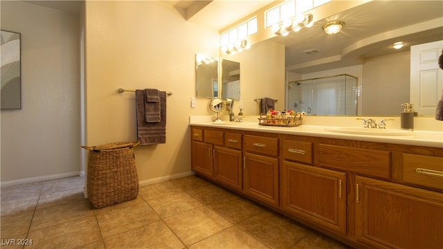 bathroom featuring tile patterned flooring and vanity