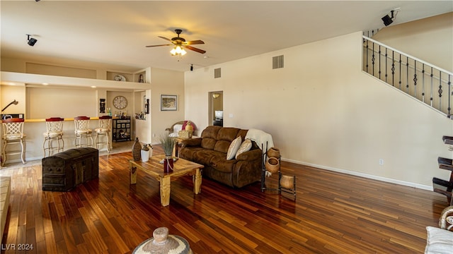 living room featuring dark hardwood / wood-style floors and ceiling fan