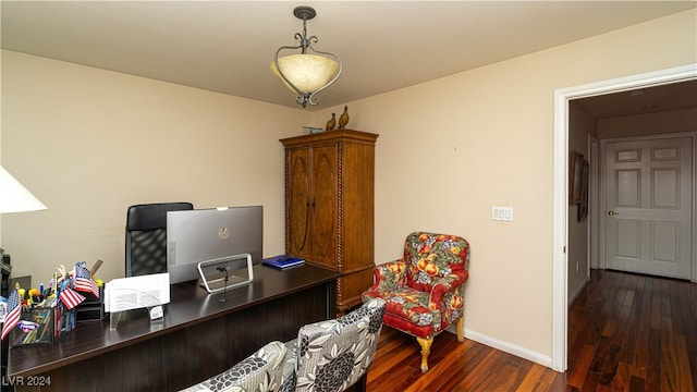 office with dark hardwood / wood-style flooring