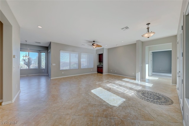 unfurnished living room with ceiling fan and light tile patterned floors