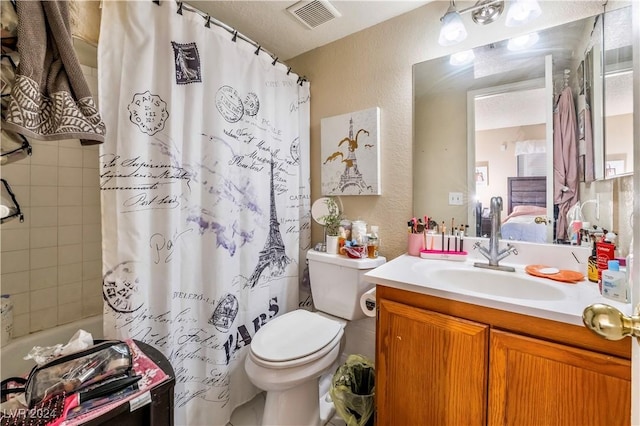 full bathroom featuring vanity, shower / bath combination with curtain, toilet, and a textured ceiling