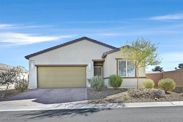 ranch-style home featuring a garage