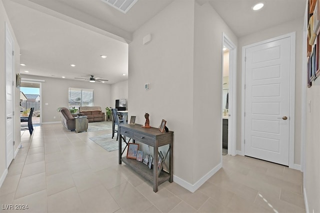 corridor with light tile patterned floors