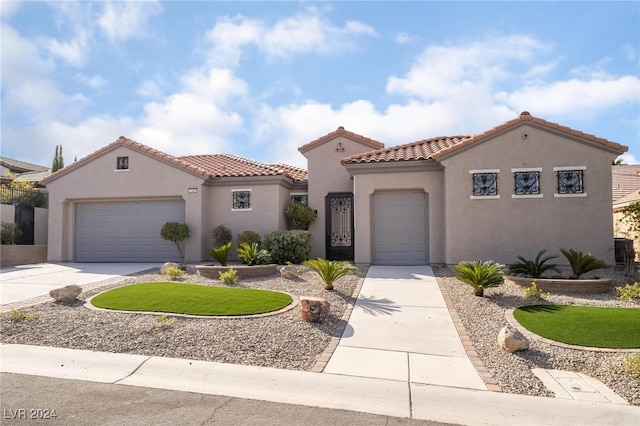 mediterranean / spanish-style home featuring a garage