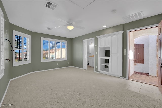 interior space featuring ceiling fan