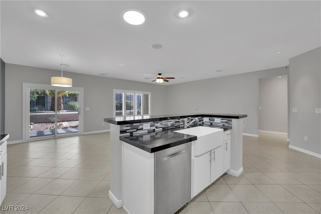 kitchen featuring white cabinetry, sink, ceiling fan, pendant lighting, and decorative backsplash