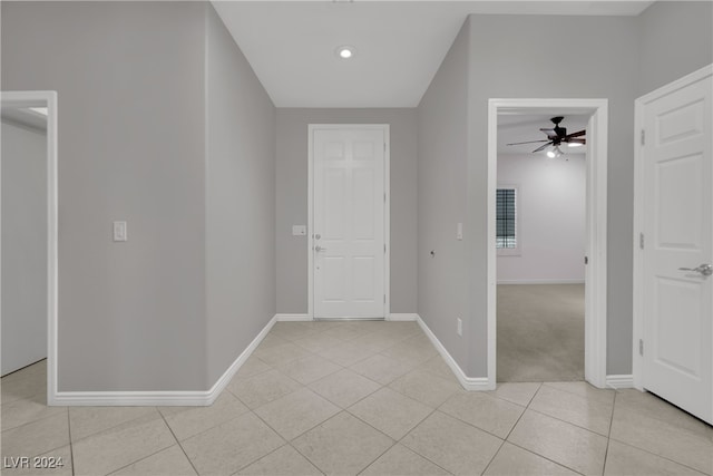 tiled entrance foyer with ceiling fan