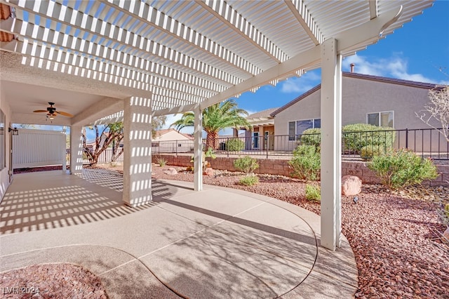 view of patio featuring a pergola and ceiling fan