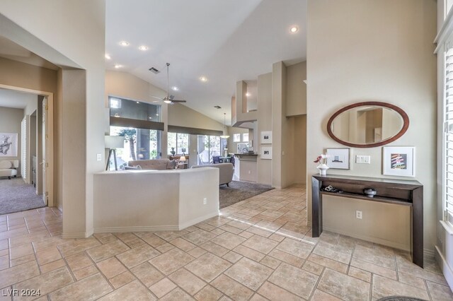 kitchen with high vaulted ceiling and ceiling fan