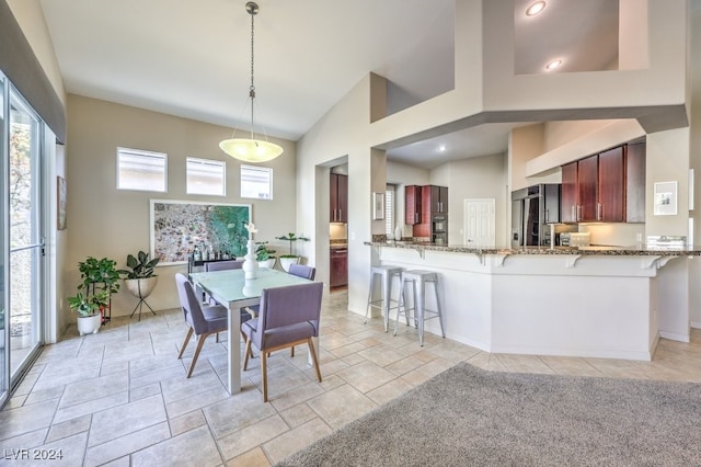 dining space with a high ceiling