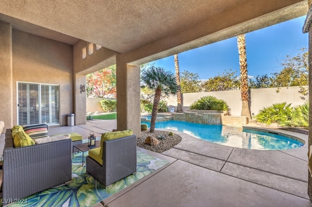 view of pool featuring an outdoor living space and a patio area