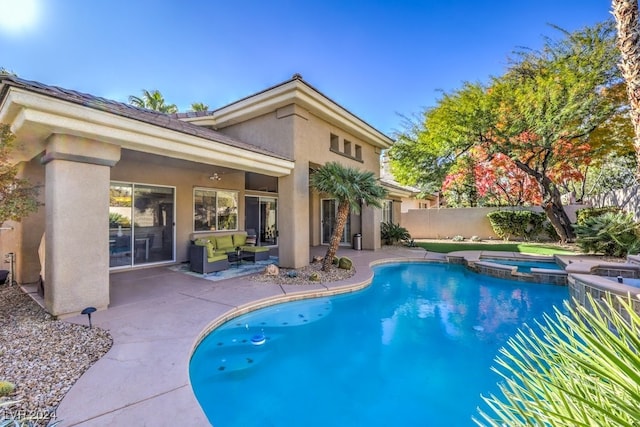 view of pool with an in ground hot tub and a patio area