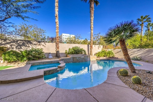 view of pool with an in ground hot tub