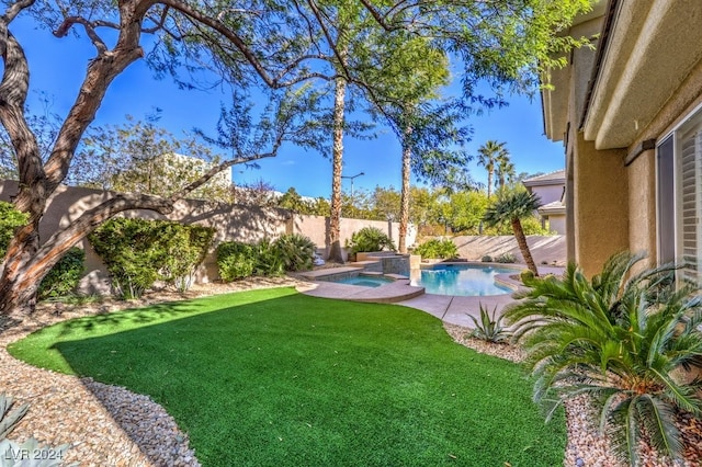 view of yard with a fenced in pool