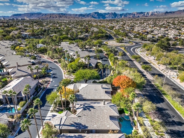 birds eye view of property with a mountain view