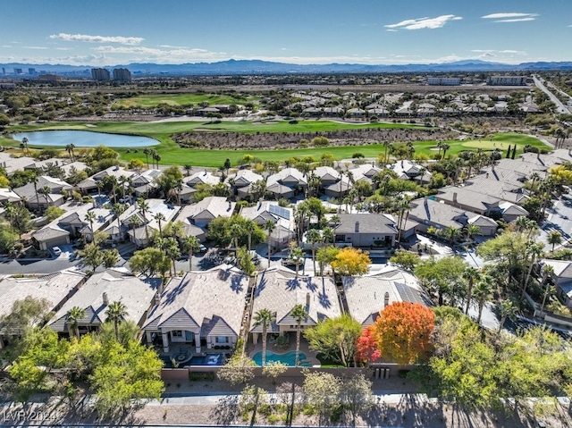 aerial view featuring a water and mountain view