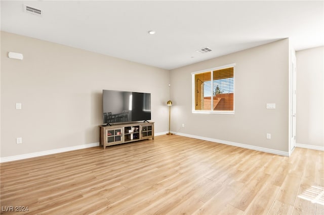 unfurnished living room featuring light hardwood / wood-style flooring