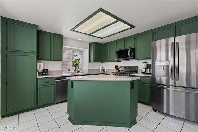 kitchen featuring appliances with stainless steel finishes, a kitchen island, and green cabinets