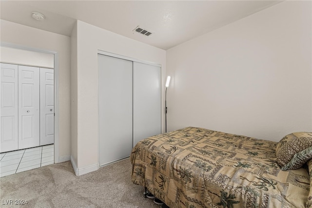 bedroom with light colored carpet