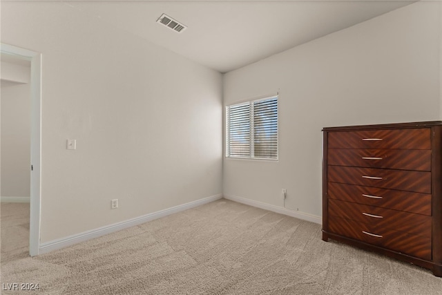 unfurnished bedroom with light carpet