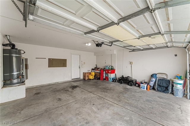 garage featuring gas water heater and a garage door opener