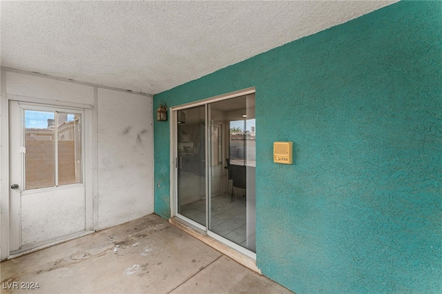 interior space with a textured ceiling