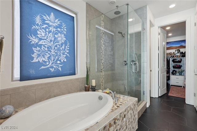 bathroom with tile patterned flooring and independent shower and bath