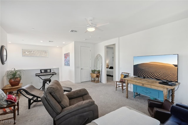 living room featuring ceiling fan and light carpet